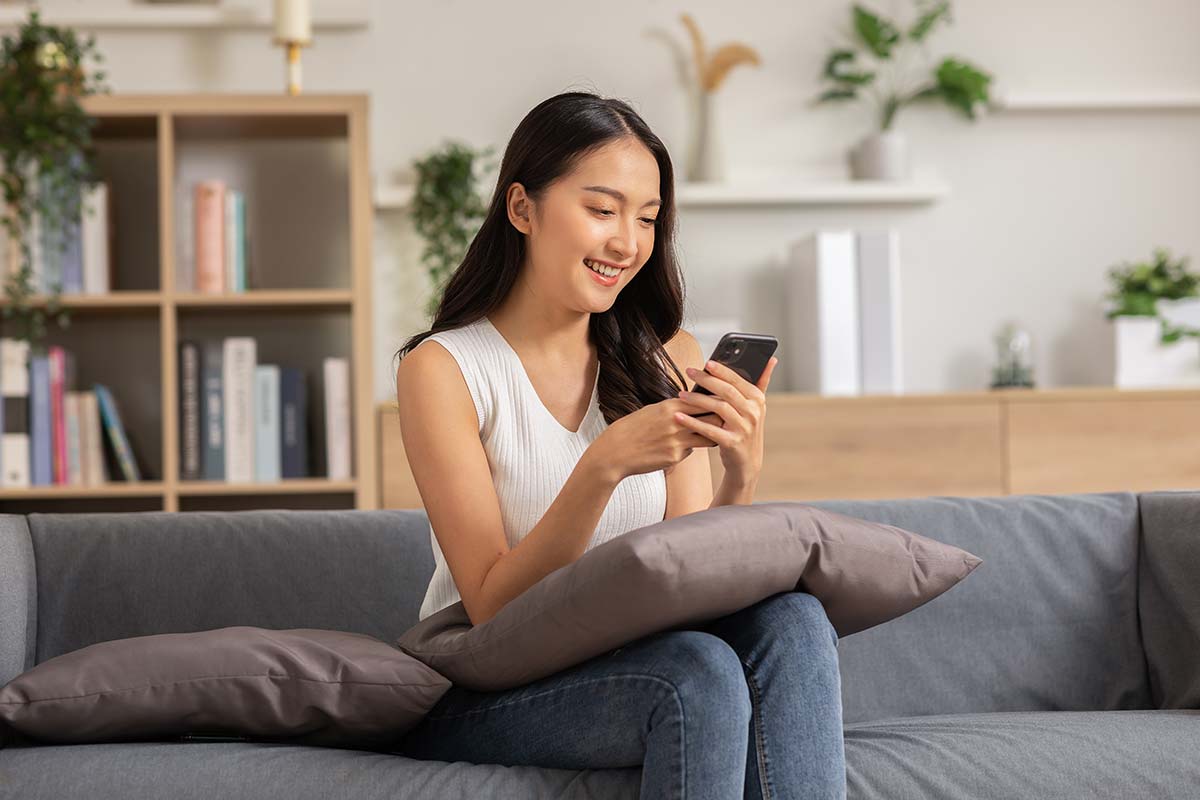 A woman scrolling on her phone